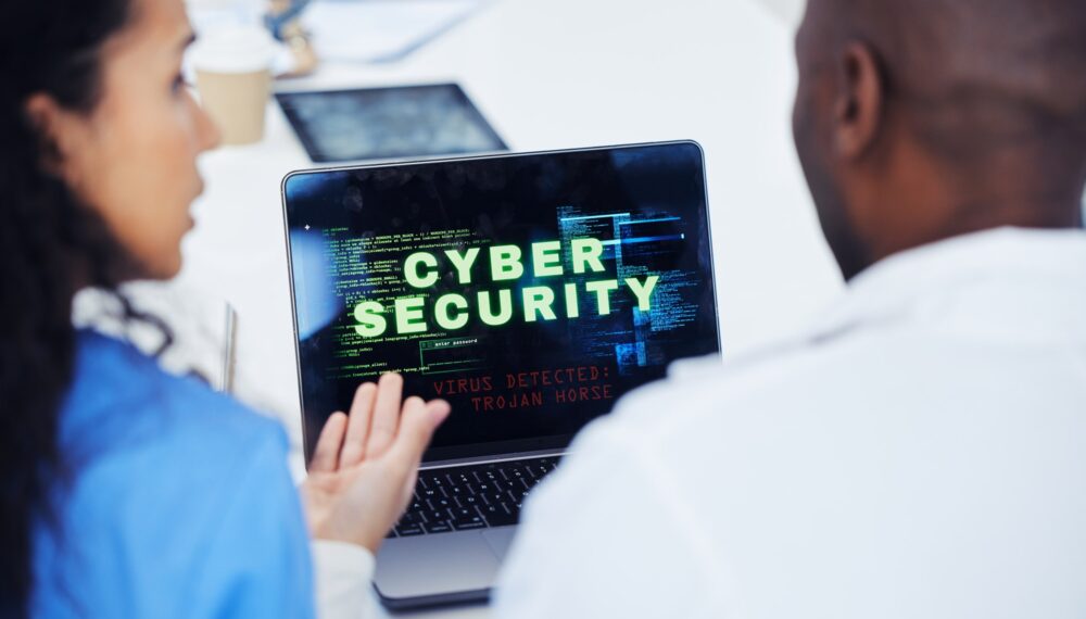 Cyber security, laptop and hospital nurse doctors with tech problem, malware virus or trojan horse.