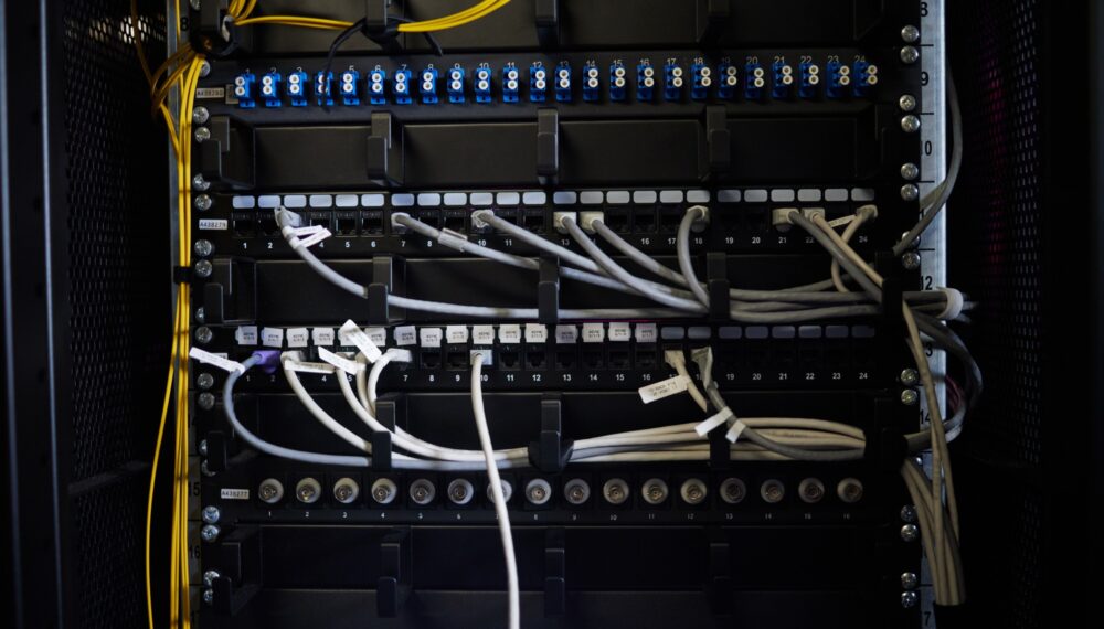 Cables, wires or server room maintenance in engineering, software programming or cybersecurity IT.