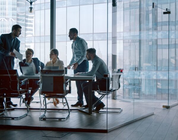 Corporate leader handing out statistics of the company's financial development strategy