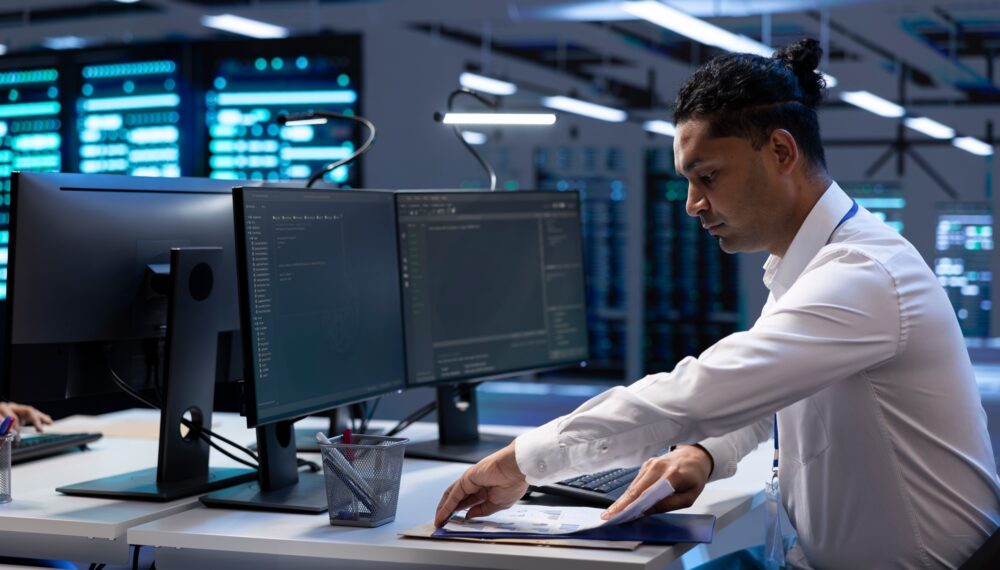 Engineer maintaining accurate documentation of data center infrastructure,